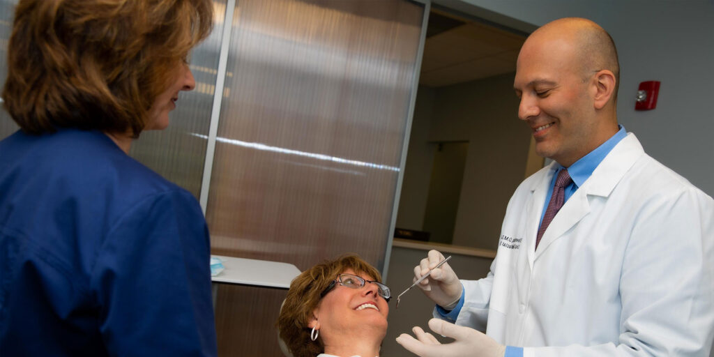 Patient being examined by doctor for dental procedure